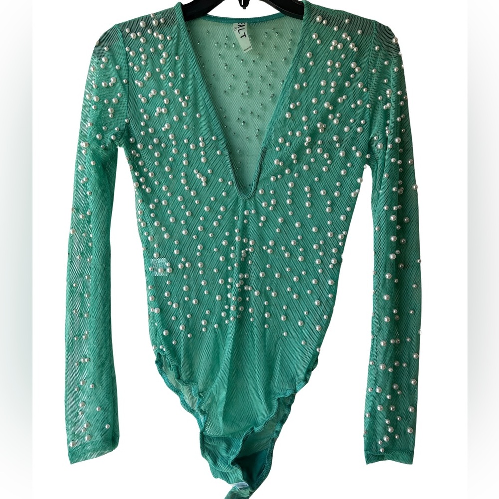 Green bodysuit with pearls.
